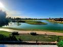 Scenic golf course view with a winding lake and manicured green, perfect for a relaxing day outdoors at 7512 N Via Camello Del Sur --, Scottsdale, AZ 85258