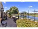 Charming patio area overlooking the golf course with manicured landscaping and wrought iron fence at 7512 N Via Camello Del Sur --, Scottsdale, AZ 85258