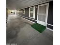 Spacious carport with concrete flooring leading to the front entrance of the house at 8103 E Southern Ave # 279, Mesa, AZ 85209
