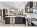 Open-concept kitchen featuring stainless steel appliances, sleek countertops, and seamless flow to the living area at 10335 E Morning Star Dr, Scottsdale, AZ 85255