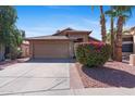 Attractive single-story home with a lush bougainvillea bush in the front yard and well-maintained landscaping at 17424 N 1St Ave, Phoenix, AZ 85023