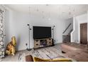 Spacious living room with modern decor and a staircase leading to the upper level at 2040 S Longmore -- # 9, Mesa, AZ 85202