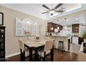 Cozy dining area with stylish furnishings, a ceiling fan, and seamless flow to the modern kitchen at 2219 E Catalina Dr, Phoenix, AZ 85016