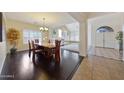 Inviting dining room featuring a large table with view to the living room at 2425 W Woburn Ln, Phoenix, AZ 85085
