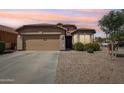 Charming single-Gathering home with a two-car garage, desert landscaping, and a welcoming entrance at 2768 W Jasper Butte Dr, San Tan Valley, AZ 85144