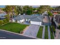 Aerial view of single-story home with a large yard, block fence, gated driveway and private backyard pool at 3027 W Wescott Dr, Phoenix, AZ 85027