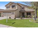Lovely two-story house with lush green lawn, neutral stucco, and an attached two-car garage with a spacious driveway at 3478 E Park Ave, Gilbert, AZ 85234