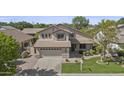 Two-story home featuring a neutral color scheme, well-maintained lawn, and an attached two-car garage at 3478 E Park Ave, Gilbert, AZ 85234