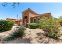 Beautiful single-story home with a tile roof, an arched entryway, a well-maintained desert front yard, and a two-car garage at 3935 E Graphite Rd, San Tan Valley, AZ 85143