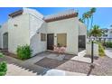 Charming condo exterior with a cozy patio area and red bistro set at 4730 W Northern Ave # 1141, Glendale, AZ 85301