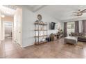 Inviting living room with neutral colors, tile floors, and comfortable furnishings at 5635 W Pecan Rd, Laveen, AZ 85339