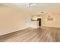 Bright living area featuring stylish flooring, a ceiling fan and kitchen access at 5757 W Eugie Ave # 2084, Glendale, AZ 85304