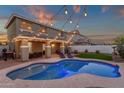 Backyard featuring pool, patio, and lounge chairs provides ample space for outdoor relaxation at 5919 S Banning St, Gilbert, AZ 85298