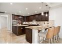 Gourmet kitchen with granite countertops, dark wood cabinets, and stainless steel appliances at 7175 E Camelback Rd # 510, Scottsdale, AZ 85251