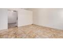Spacious living room featuring tile floors and neutral walls, awaiting your personal touch at 870 S Palm Ln # 55, Chandler, AZ 85225