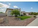 Side view of a home showing gravel landscaping and a small lawn at 9281 W Villa Chula --, Peoria, AZ 85383