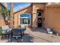 Charming patio area with comfortable seating, string lights, and attractive landscaping at 15020 S 25Th St, Phoenix, AZ 85048