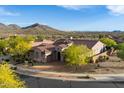 Expansive home boasts lush landscaping, a tile roof, and stunning mountain views in a desert setting at 1713 W Calle Marita --, Phoenix, AZ 85085