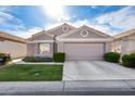 Charming home with two-car garage, desert landscaping, and lovely architectural details at 17162 N Winding Trl, Surprise, AZ 85374
