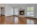 Inviting living room with cozy fireplace and plantation shutters at 18802 N 71St Ln, Glendale, AZ 85308