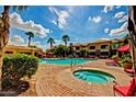 Relaxing community pool and spa area with manicured grounds and lounge chairs at 1941 S Pierpont Dr # 1099, Mesa, AZ 85206