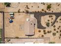 Panoramic aerial view showcasing the well-maintained property layout with a driveway, and an expansive surrounding landscape at 20041 W Colter St, Litchfield Park, AZ 85340