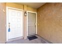 Close-up of unit entrance with security screen door at 2146 W Isabella Ave # 131, Mesa, AZ 85202