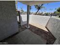 Enclosed patio area features privacy walls and gated entrance, offering a private outdoor space at 3314 N 68Th St # 107, Scottsdale, AZ 85251