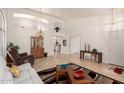 Bright living room with vaulted ceilings, light hardwood floors, and an open layout at 623 W Harvard Ave, Gilbert, AZ 85233