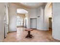 Spacious entryway featuring tile floors, high ceilings, and elegant architectural details at 7217 S Hazelton Ln, Tempe, AZ 85283