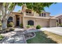 Charming two-story home featuring a private balcony, three-car garage, and well-manicured lawn at 7217 S Hazelton Ln, Tempe, AZ 85283