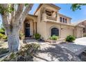 Beautiful home exterior featuring a quaint balcony, manicured landscaping, and a welcoming front entrance at 7217 S Hazelton Ln, Tempe, AZ 85283