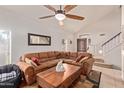 Cozy living room featuring comfortable seating and lots of natural light at 7512 W Tonto Dr, Glendale, AZ 85308