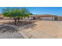 Charming single-story home with desert landscaping, an attached two-car garage and long driveway at 8767 W Villa Hermosa --, Peoria, AZ 85383