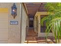 Inviting front entry with iron gate, lantern lighting, and decorative house number at 9241 S 50Th St, Phoenix, AZ 85044