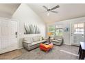 Bright living room with vaulted ceilings, light gray paint, plush carpet, and contemporary decor at 9990 N Scottsdale Rd # 2042, Paradise Valley, AZ 85253