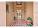 Grand entryway featuring patterned tile flooring, potted cacti, and a view into the home at 10182 E Gilded Perch Dr, Scottsdale, AZ 85255