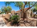 Exterior shot with desert landscaping showcasing the building's stucco facade and red tile roof at 1111 W Summit Pl # 85, Chandler, AZ 85224