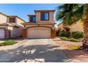 Inviting two-story home featuring a two-car garage, desert landscaping, and a welcoming facade at 11429 W Yavapai St, Avondale, AZ 85323