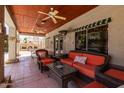 Relaxing outdoor patio with comfortable seating, ceiling fans, and view of the backyard at 1181 N Dustin Ln, Chandler, AZ 85226