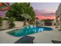 Inviting pool with waterfall feature and ample patio space, ideal for outdoor enjoyment at 1181 N Dustin Ln, Chandler, AZ 85226