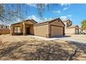 Attractive single-story home with a two-car garage and low-maintenance desert yard at 12621 W Willow Ave, El Mirage, AZ 85335