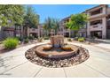 Community courtyard featuring fountain and desert landscaping at 14000 N 94Th St # 1008, Scottsdale, AZ 85260