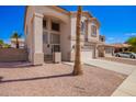 Attractive home with a two-car garage and desert landscaping, providing a great curb appeal at 17258 W Meghan Dr, Goodyear, AZ 85338