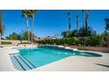 Sparkling pool featuring a diving board and a raised platform with decorative pottery at 1739 E Knox Rd, Tempe, AZ 85284