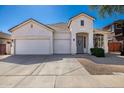 Charming single-Gathering home with a well-manicured lawn, three-car garage, and welcoming front door at 2028 S Esmeralda --, Mesa, AZ 85209
