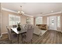 Inviting living room with elegant furnishings, wood floors, and abundant natural light at 2028 S Esmeralda --, Mesa, AZ 85209