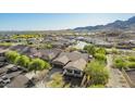 Expansive aerial view of a residential community with well-maintained homes and desert landscaping at 2674 N Saide Ln, Buckeye, AZ 85396