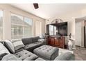 Comfortable living room with plush sectional, TV, and natural light from large window at 280 S Evergreen Rd # 1320, Tempe, AZ 85288