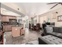A comfortable open-concept living space with a kitchen island, living room, and dining area at 280 S Evergreen Rd # 1320, Tempe, AZ 85288
